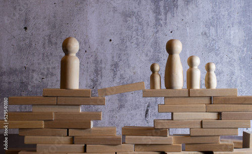 Photos Wooden home with happy family of paper art is placed inside on nature bokeh in t