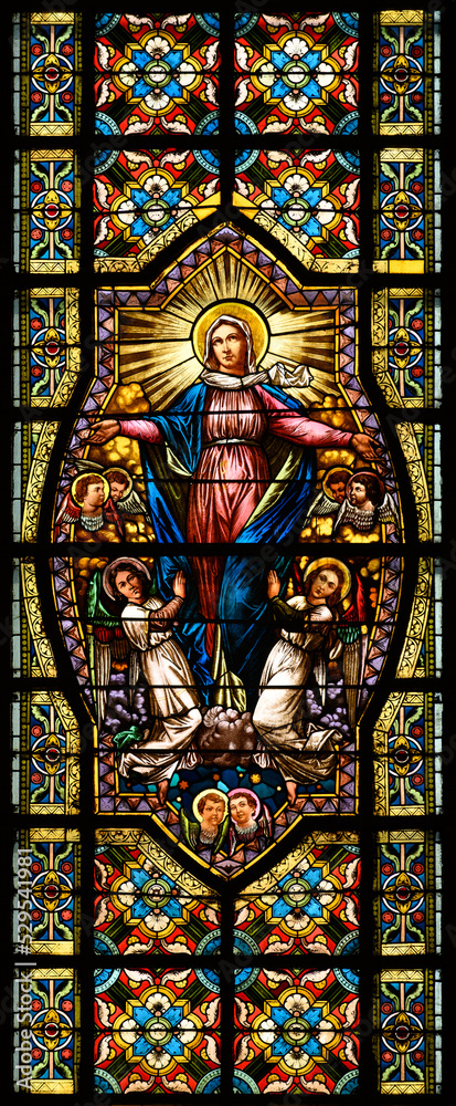 Stained-glass window depicting the Assumption of the Virgin Mary. Blumental church in Bratislava, Slovakia. 2021/07/20.