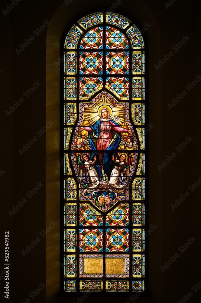 Stained-glass window depicting the Assumption of the Virgin Mary. Blumental church in Bratislava, Slovakia. 2021/07/20.