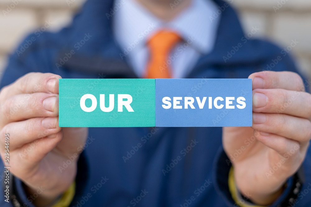 Our Services Business Concept. Service Advertising. Businessman holding styrofoam colorful blocks with inscription: our services. Our Services Business Concept. Service Advertising. Businessman holding styrofoam colorful blocks with inscription: our services.