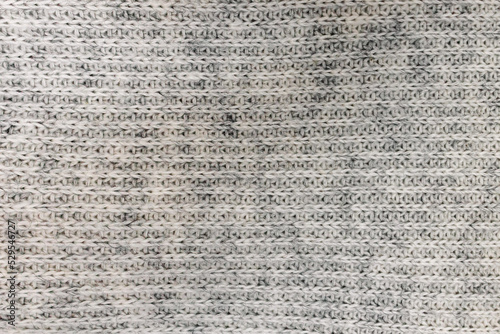 Grey knitted texture close-up photo