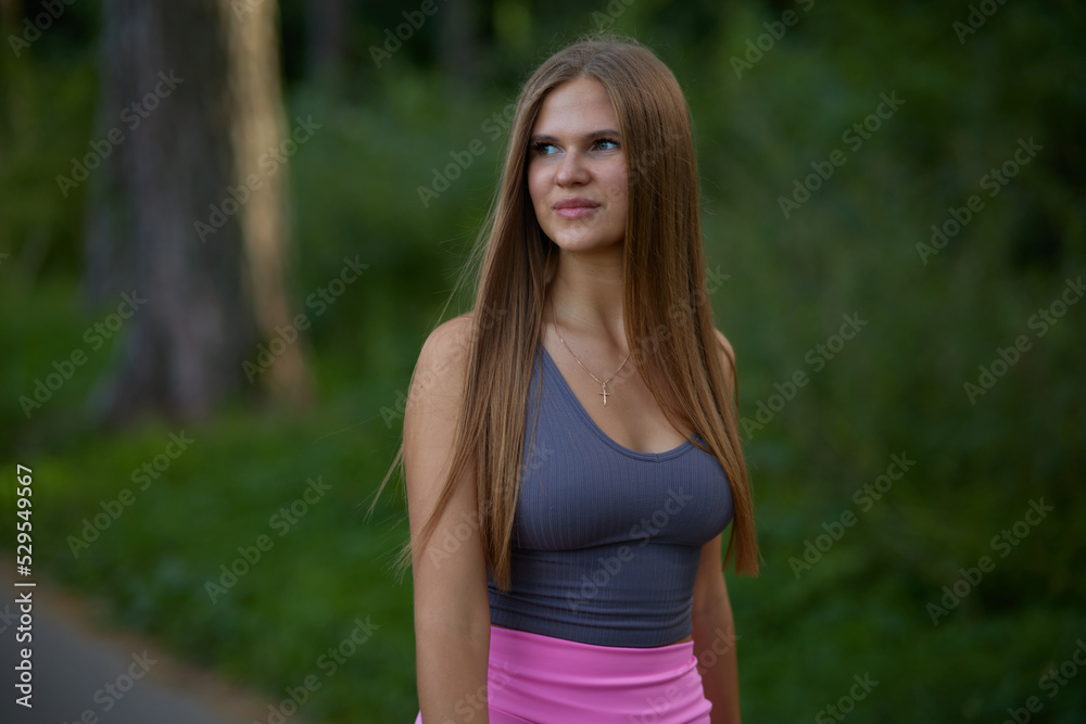 Lovely young woman with sexy boobs in trendy gray top in pink fashionable sports shorts walking on street. Pretty beauty girl fashion model walks in park. Healthy lifestyle.
Lovely young woman with sexy boobs in trendy gray top in pink fashionable sports shorts walking on street. Pretty beauty girl fashion model walks in park. Healthy lifestyle.