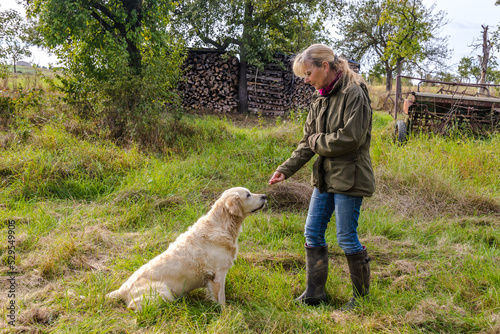 Woman gives her dog a treat © Birgit Reitz-Hofmann