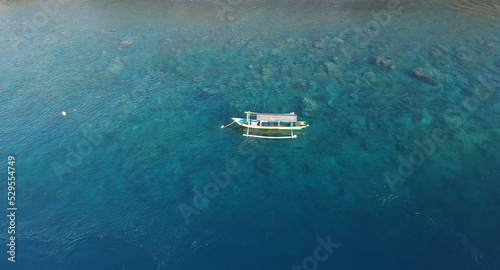 A fisherman boat in the middle of the sea.