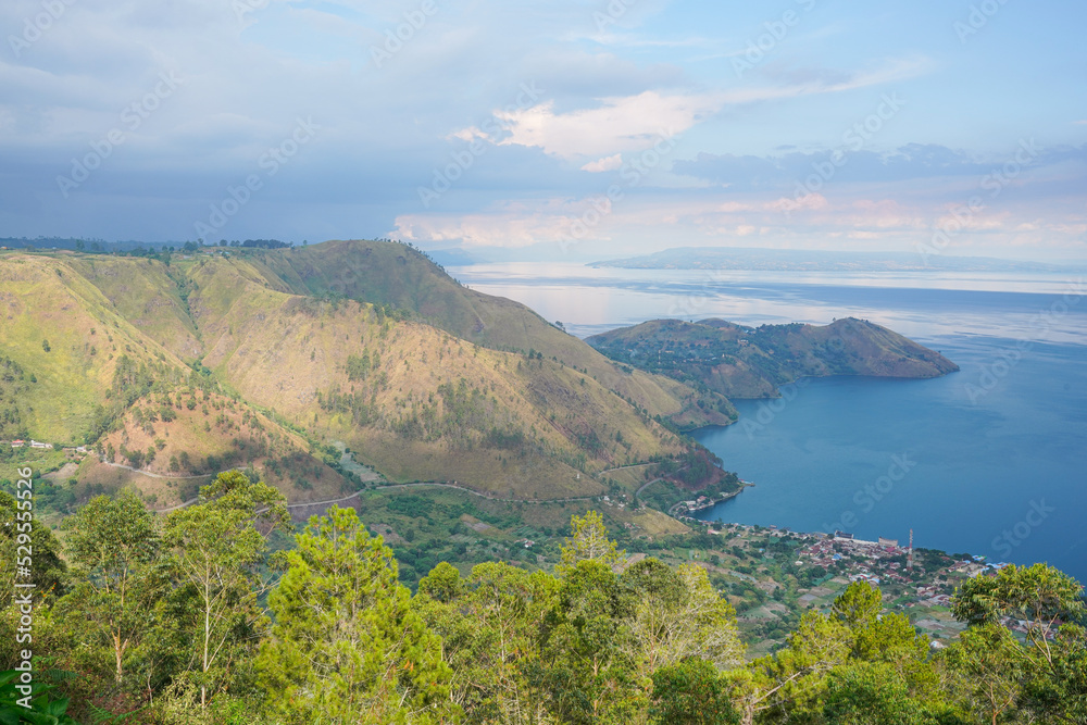 Lake Toba (Indonesian: Danau Toba) is a large natural lake in North Sumatra, Indonesia, occupying the caldera of a supervolcano. Lake Toba (Indonesian: Danau Toba) is a large natural lake in North Sumatra, Indonesia, occupying the caldera of a supervolcano.