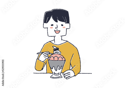 パフェを食べる男性　美味しそうにスイーツを食べている人々