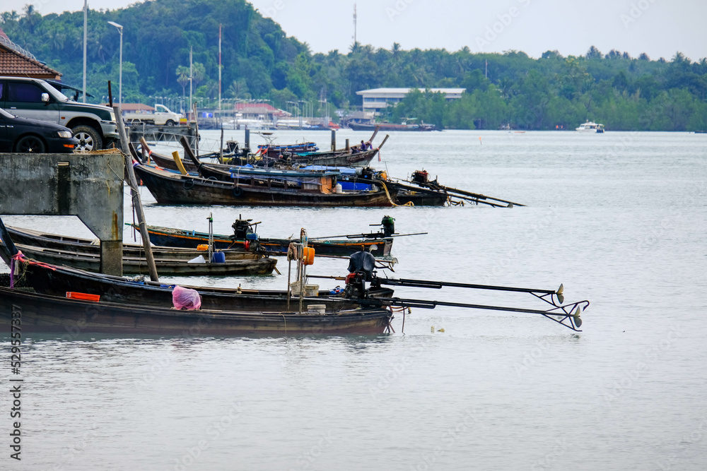 Fishing boats moored in a local fishing jetty on Yao Yai Island, Phang Nga, Thailand.