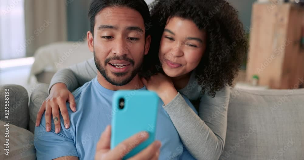 Communication, phone and video call with couple waving, talking and looking happy while having zoom conversation while sitting at home. Man and woman greeting with 5g network connection on smartphone