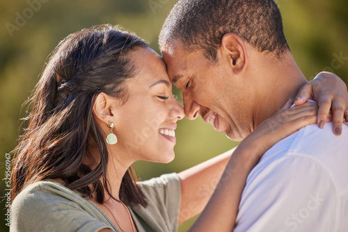 Happy, forehead and couple with love smile, bond and relax in romantic nature park date. Peace, freedom and beauty for man and woman on getaway to a green Spring forest, woods or outdoor adventure