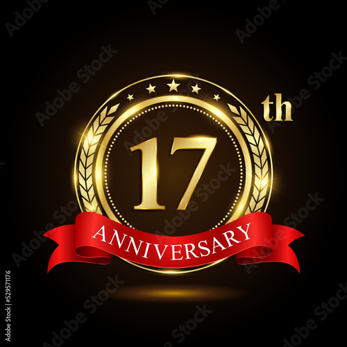 17th golden anniversary logo, with shiny ring and red ribbon, Laurel wrath isolated on black background, vector design
