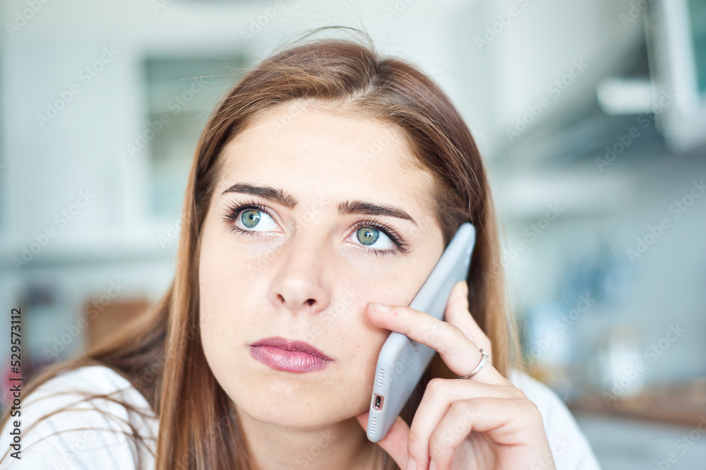 teenager brunette Caucasian girl talking on her smartphone teenager brunette Caucasian girl talking on her smartphone