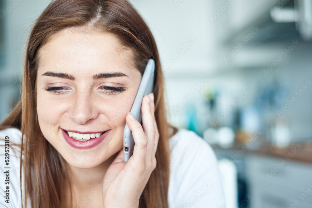 teenager brunette Caucasian girl talking on her smartphone teenager brunette Caucasian girl talking on her smartphone
