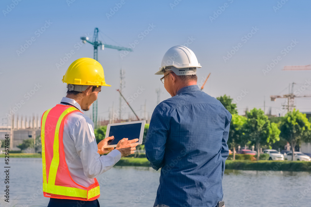 Asian engineer construction team checking work for control and management in the construction site or building site Asian engineer construction team checking work for control and management in the construction site or building site