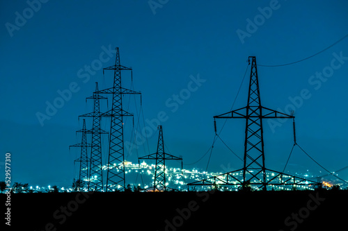 night city lights behind the power lines