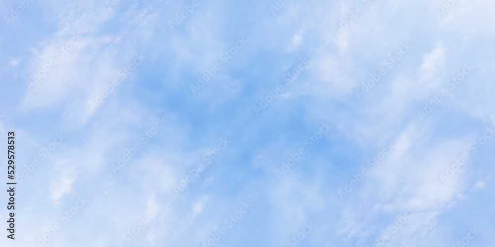 Obraz premium Tiny clouds covered the winter seasonal morning blue sky background, fresh and clear view of morning sky with puffy clouds, beautiful sky background for wallpaper, calender, cover and any design.