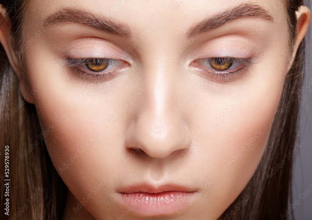 Closeup portrait of human female face with nude makeup. Closeup portrait of human female face with nude makeup.