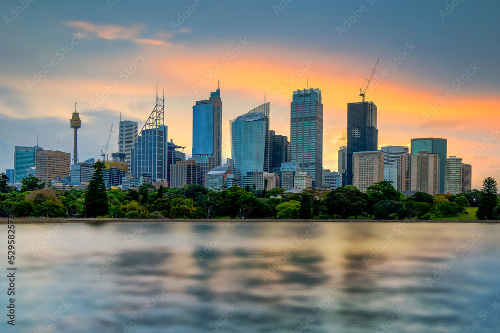 Sunset at Sydney, Australia. Cityscape of building at Sydney central business around the harbour. Aerial view of Sydney business building at dusk. Sunset at Sydney, Australia. Cityscape of building at Sydney central business around the harbour. Aerial view of Sydney business building at dusk.