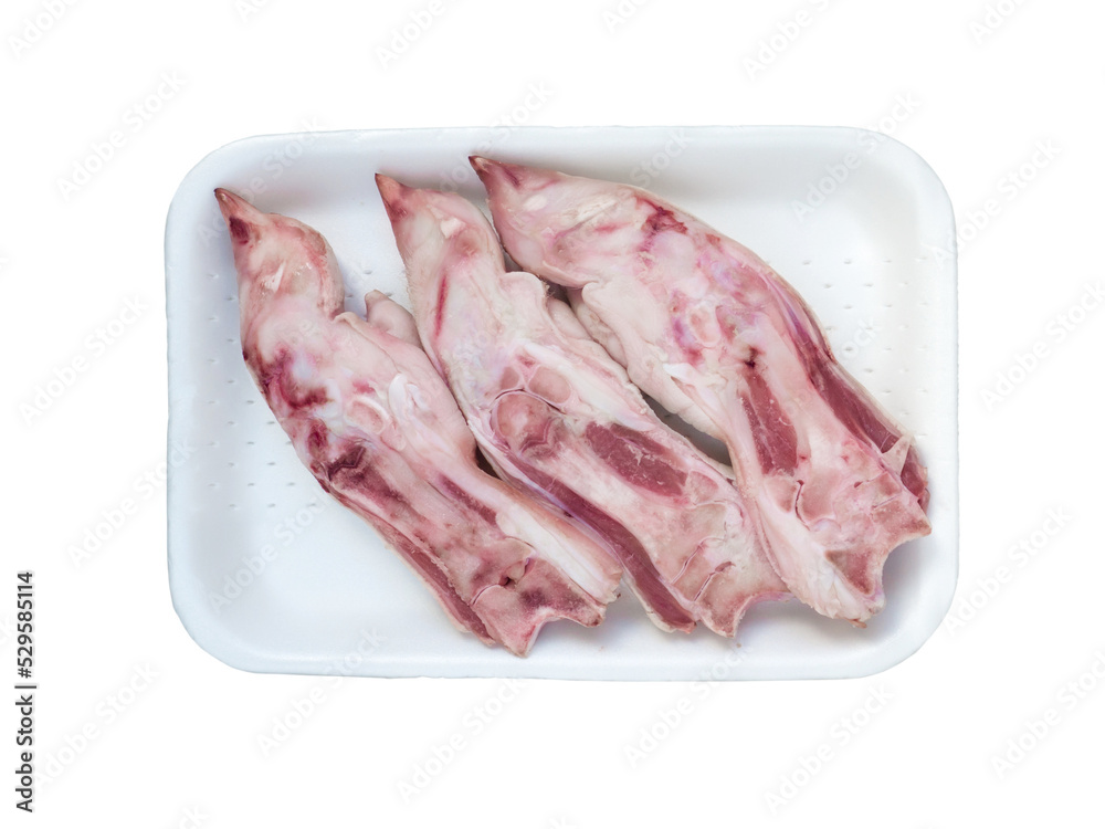Pork feet in the white tray isolated transparent png top view. Legs for the preparation of jelly. Pork feet in the white tray isolated transparent png top view. Legs for the preparation of jelly.