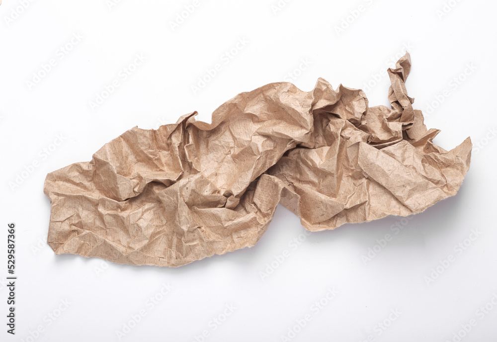 Crumpled craft paper on a white background. Eco concept. Crumpled craft paper on a white background. Eco concept.