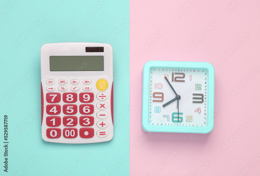 Calculator with clock on pink pastel background. Business concept. Top view Calculator with clock on pink pastel background. Business concept. Top view