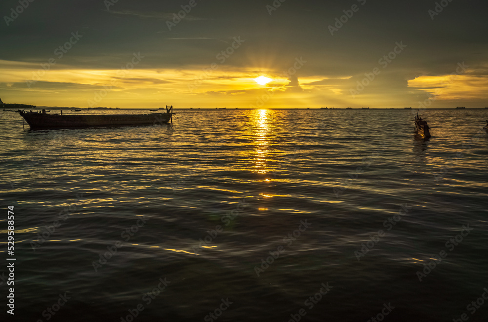 sunset at sea with silhouette of boat. beautiful sunset sky. sea landscape.