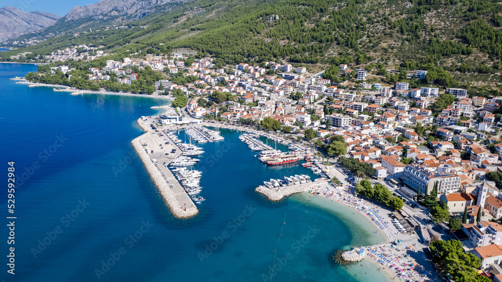 Town of Baska Voda beach and waterfront aerial view, Makarska riviera in Dalmatia, Croatia