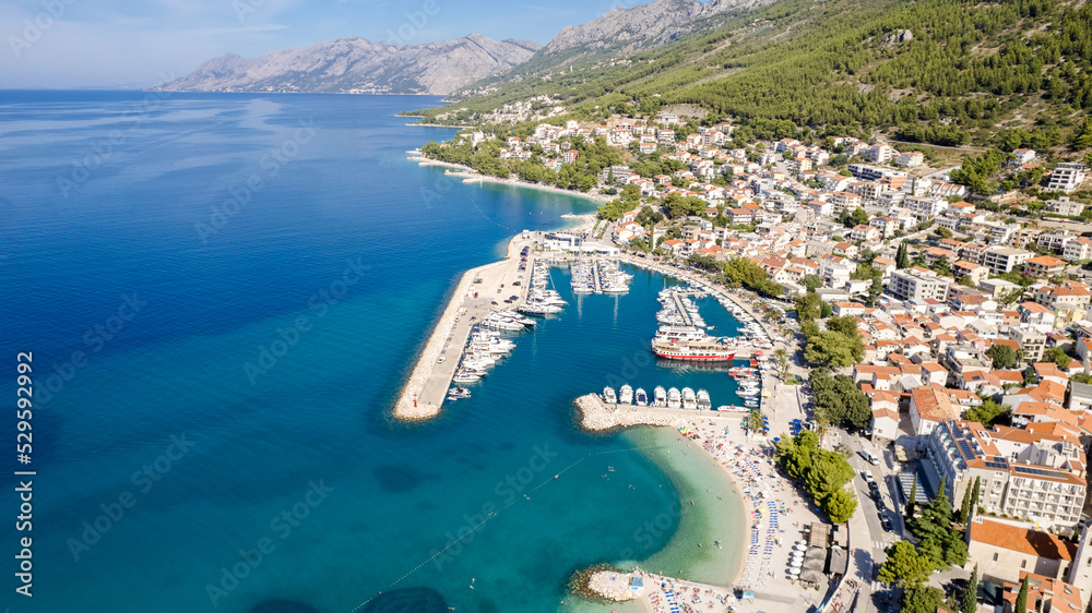 Town of Baska Voda beach and waterfront aerial view, Makarska riviera in Dalmatia, Croatia