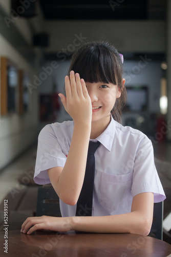 Portrait of thai Junior high school student uniform teen beautiful girl happy and relax