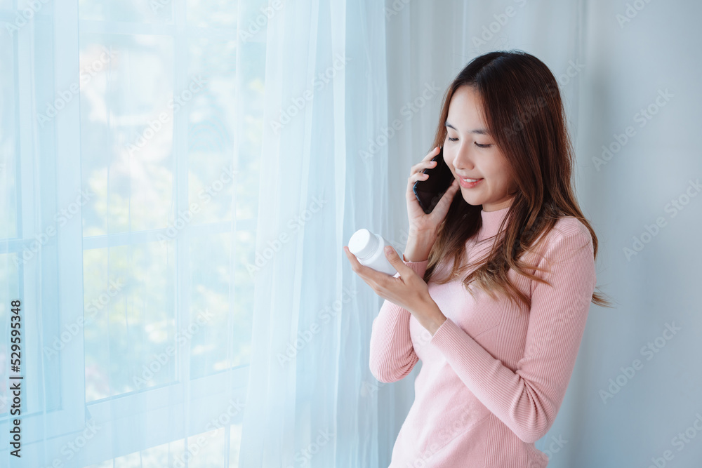 Asian woman patient talk to doctor on mobile phone online clinic videocall conference consult about eat pills on medical app, Telehealth telemedicine service hospital concept. Asian woman patient talk to doctor on mobile phone online clinic videocall conference consult about eat pills on medical app, Telehealth telemedicine service hospital concept.