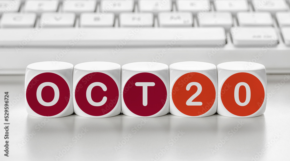 Letter dice in front of a keyboard - October 20