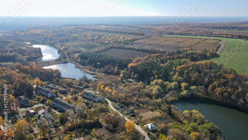 View from a height of the autumn forest and lakes in the Kharkiv region 