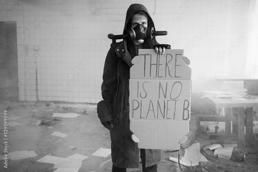 Obraz premium Protest. Global warming. Homemade poster at environmental rally. A homemade sign, saying there is no planet b, survivor in post apocalypse against climate change. black-white