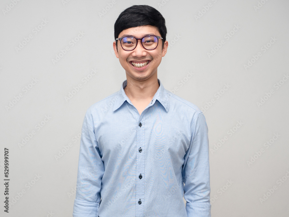 Portrait asian man wear glasses blue shirt happy smile isolated