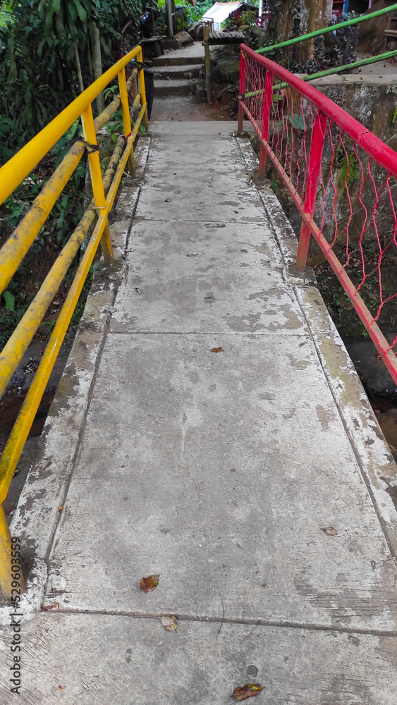 Abstract Defocused Blurred Photo of a bridge with red and yellow hand rails in the Cicalengka area - Indonesia Abstract Defocused Blurred Photo of a bridge with red and yellow hand rails in the Cicalengka area - Indonesia