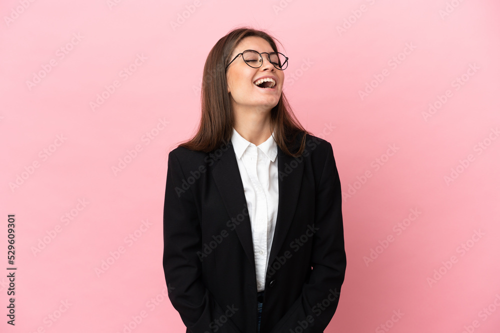 Young Business caucasian woman isolated on pink background laughing Young Business caucasian woman isolated on pink background laughing