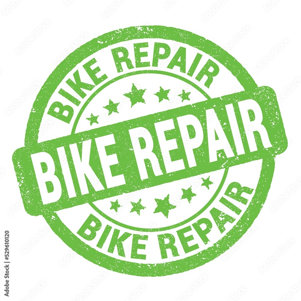 BIKE REPAIR text written on green round stamp sign. BIKE REPAIR text written on green round stamp sign.