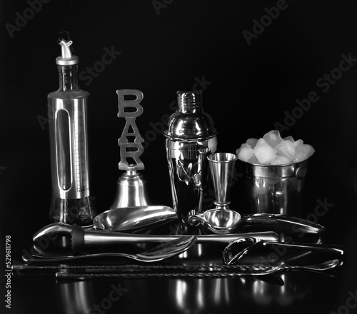 bar accessories for drinks isolated on black background