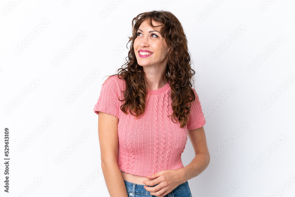 Young woman with curly hair isolated on white background thinking an idea while looking up Young woman with curly hair isolated on white background thinking an idea while looking up