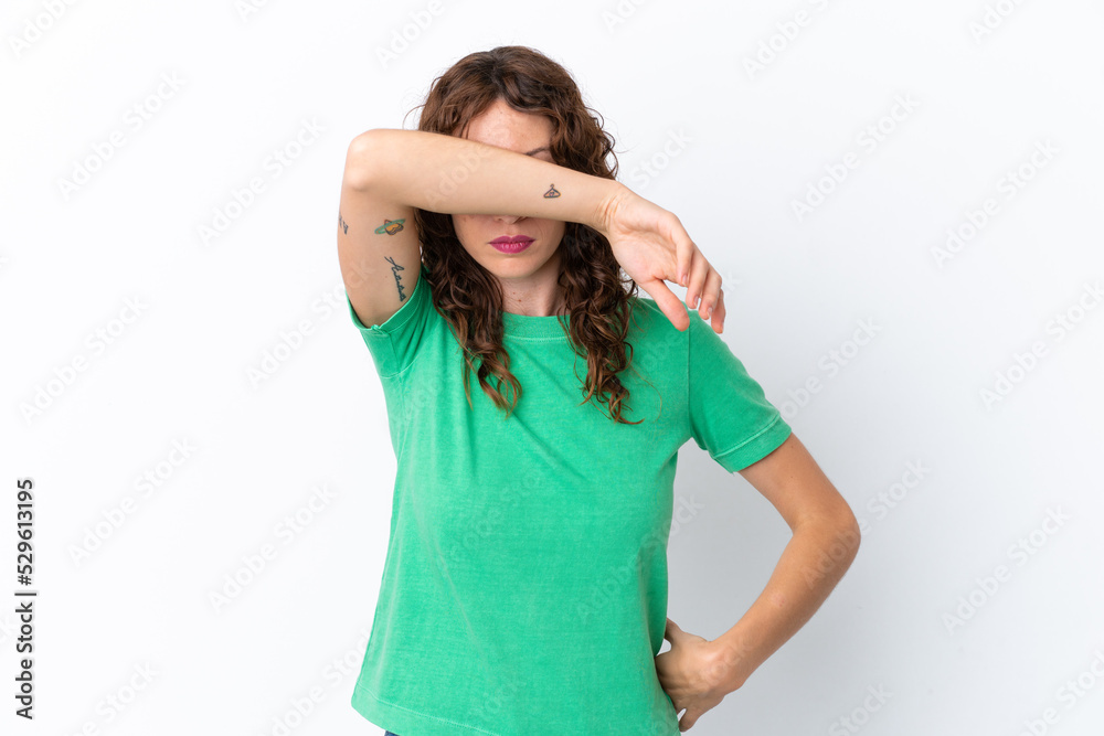 Young woman with curly hair isolated on white background covering eyes by hands Young woman with curly hair isolated on white background covering eyes by hands