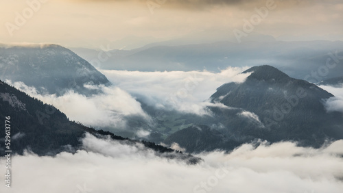 Cloudy weather condition with fog  clouds and a bit of sun in the Salzkammergut mountains in Austria
