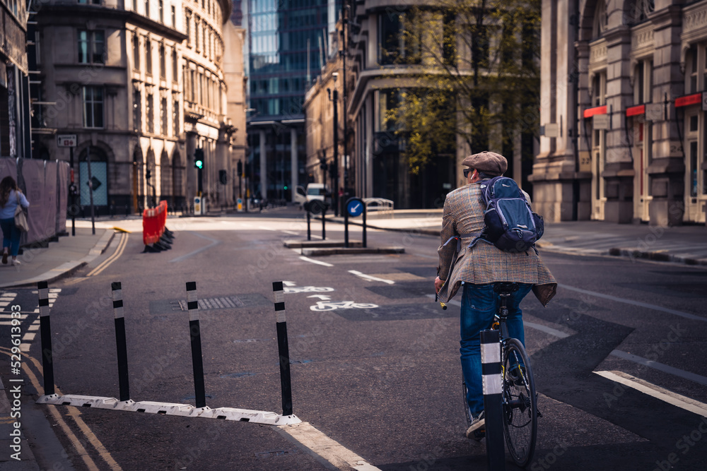 person riding a bicycle in city