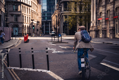 person riding a bicycle in city