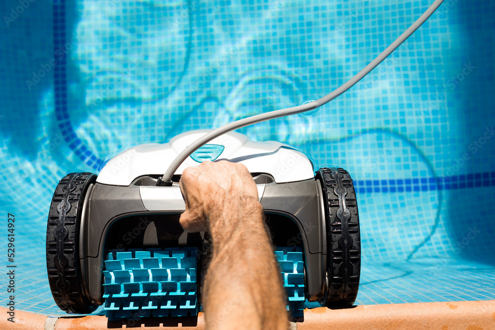 robot pool cleaner Pool maintenance with automatic robot. Cleaning the