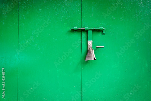 Old grunge metal door with padlock