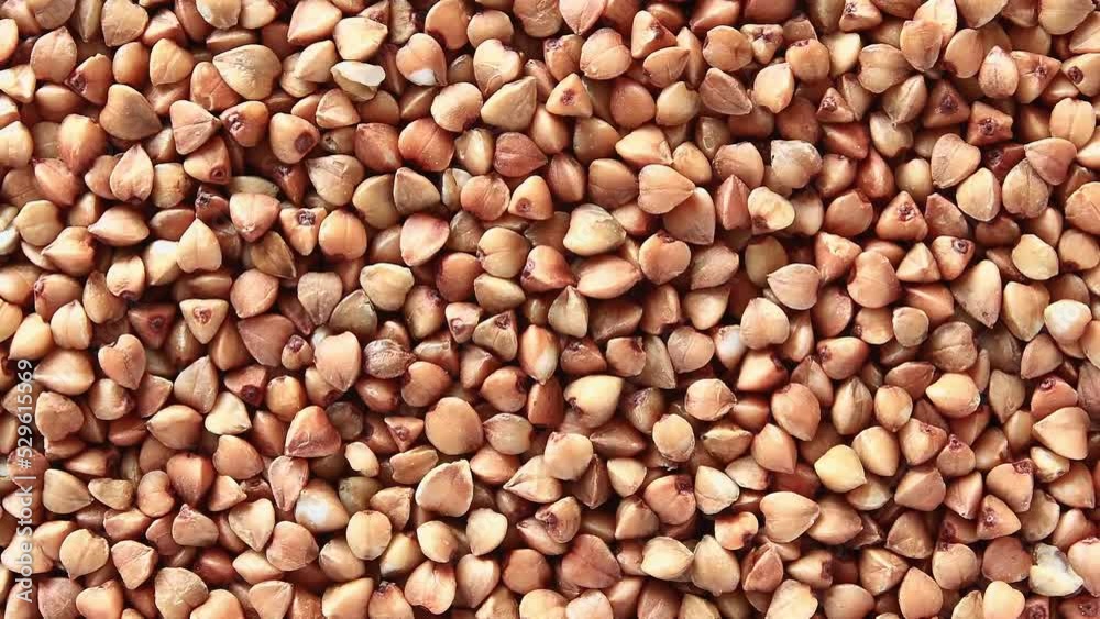 Buckwheat raw, rotating, turning, close-up macro, top view.
Buckwheat raw, rotating, turning, close-up macro, top view.