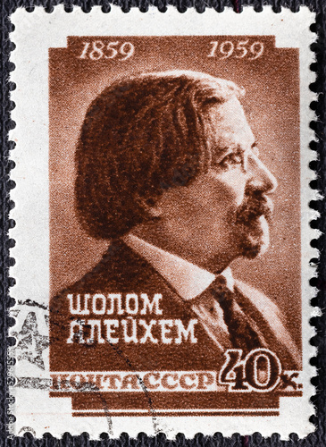 USSR - CIRCA 1959: Stamp printed in USSR Russia shows portrait of Sholem Aleichem Solomon Naumovich Rabinovich, 1859-1916 , leading Yiddish author and playwright. photo