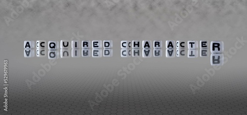 acquired character word or concept represented by black and white letter cubes on a grey horizon background stretching to infinity