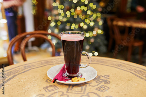 Glass of hot wine in cafe photo