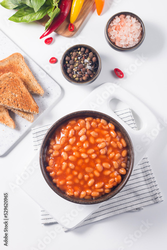 Chili beans on wooden table background. Kidney beans and vegetable Mexican food. 