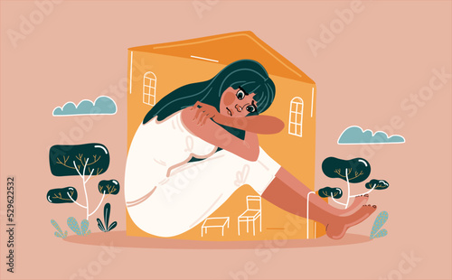 A young woman leans on her knees and sits sad in a cramped house. Sadness, depression and thoughts. The concept of loneliness, insecurity, mental illness, sadness and fatigue. Introvert teenager